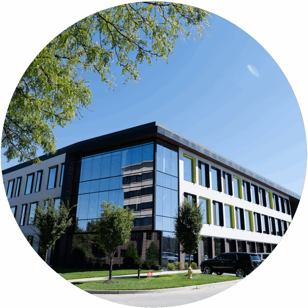 Modern office building with sleek glass and clean architectural lines, captured on a bright, clear day.