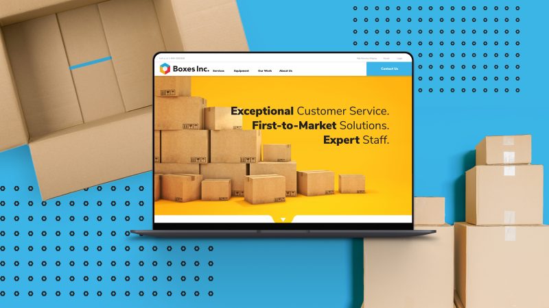 boxes inc home screen website design mocked up on a laptop next to boxes