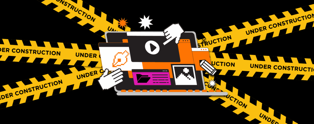 A laptop in front of Under Construction tape