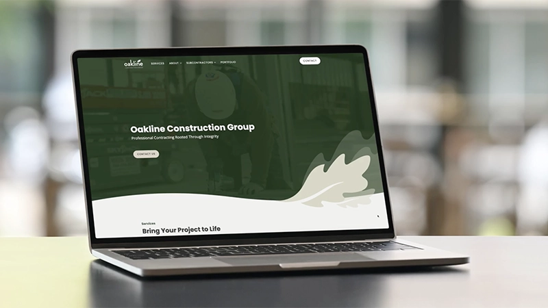 Oakline Construction website on laptop