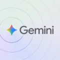 Gemini logo with a colorful star-shaped icon centered on a light gradient background with circular ripple patterns, representing Google’s Gemini AI platform.