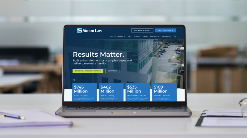 A Macbook Pro featuring the new Simon Law website