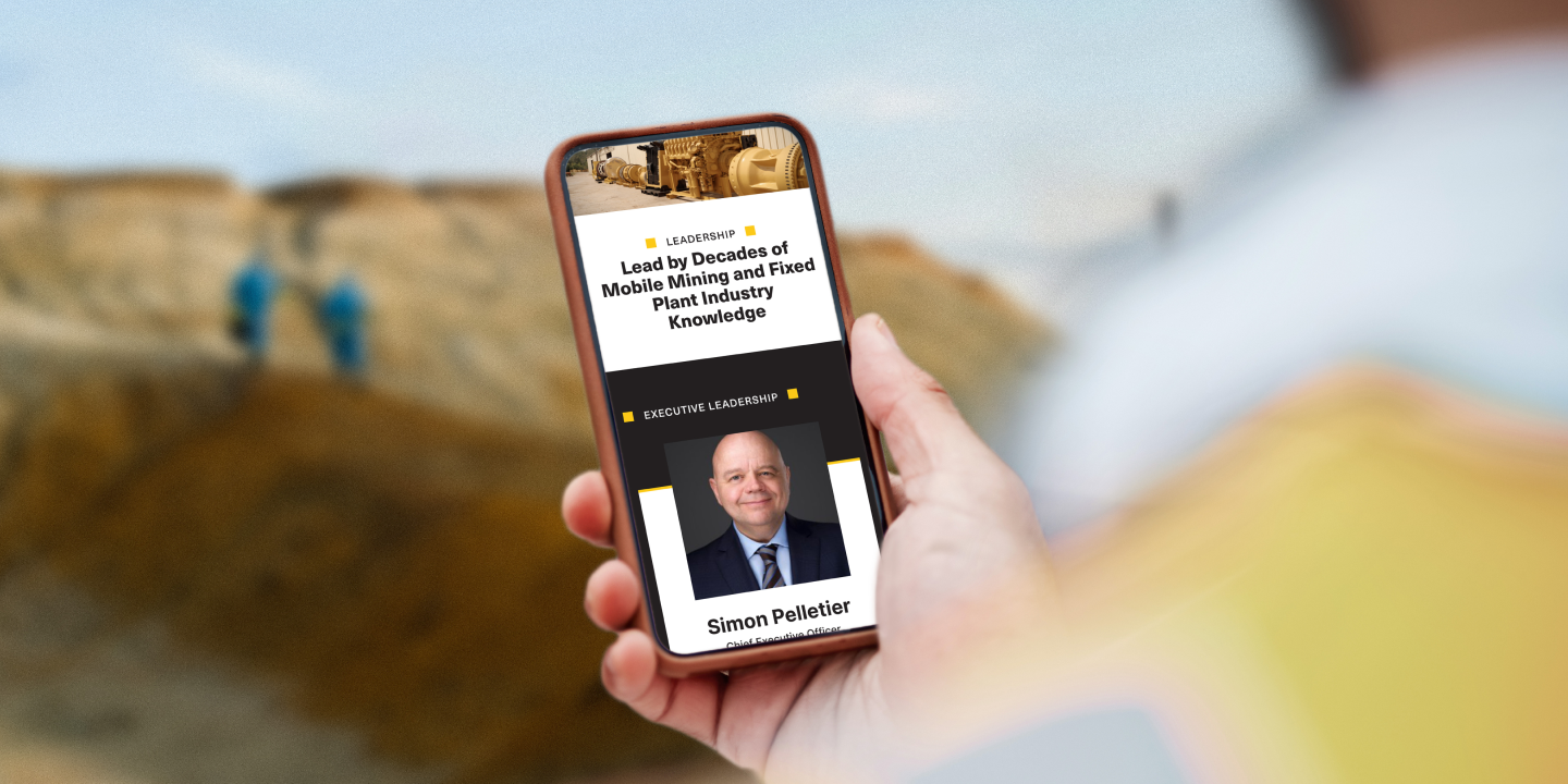 Person holding a smartphone showing the HEPI leadership webpage, highlighting executive team profiles.