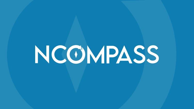 Blue background with the word "NCOMPASS" in white, featuring a stylized compass needle in the letter "O." Modern, geometric design conveys direction.