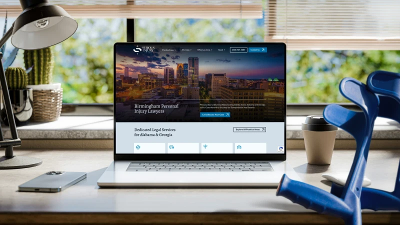 Serious Injury Law Group homepage displayed on laptop featuring Birmingham personal injury lawyers and primary call to action
