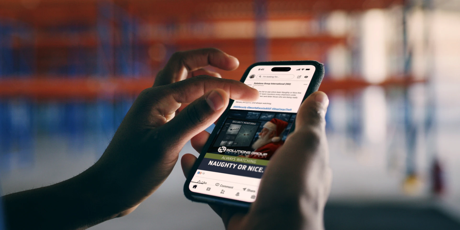 A person holds a smartphone displaying a social media post about being "Naughty or Nice." The background is blurred, suggesting a focus on the phone.