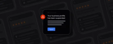A dark-themed notification with a red triangle alert icon reads, "Your business profile has been suspended," followed by an "Appeal" button.