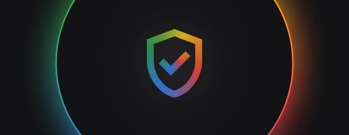 Illustration of a colorful shield with a checkmark at its center, surrounded by a glowing multicolor ring on a dark background, representing account protection, verification, or security.