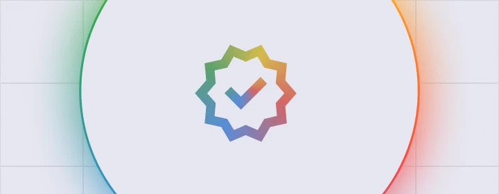 Circular graphic with a multicolored verification badge icon and checkmark centered inside a white circle with green and orange gradient edges